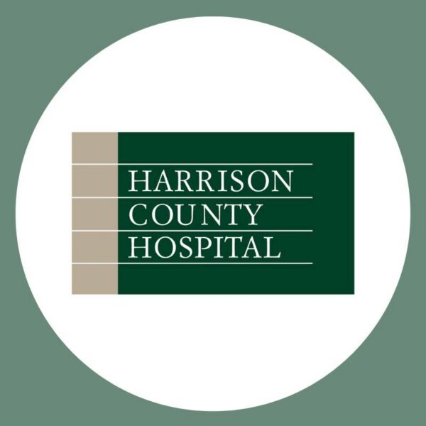 Harrison County Hospital logo: dark green panel with three beige vertical bars and white stacked text reading 'Harrison County Hospital'.